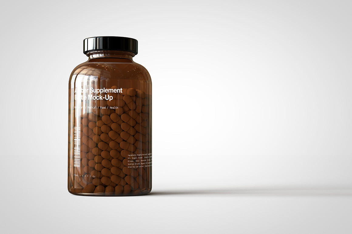 A shiny glass amber supplement/vitamins bottle mock-up full of pills on a white surface with an editable label on the front of the bottle
