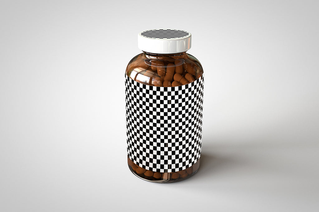 A shiny glass amber supplement/vitamins bottle mock-up full of pills on a white surface with an editable label on the front of the bottle and an editable sticker on the lid
