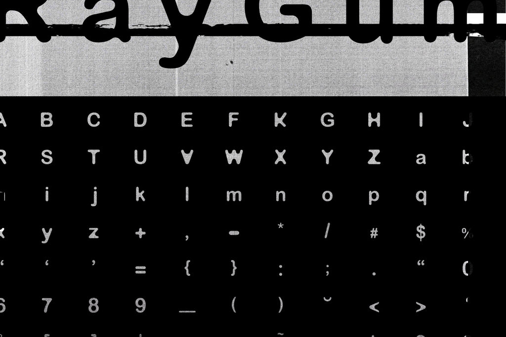RayGum - Sans Serif Grunge Font - Free - Design by The Sound Of Breaking Glass